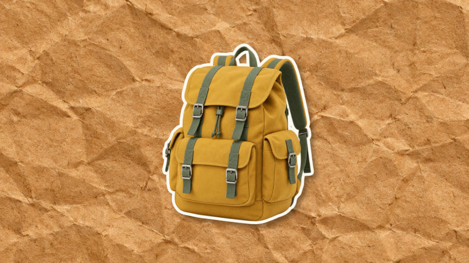 Yellow backpack revealed on textured brown paper after the crumple animation opens