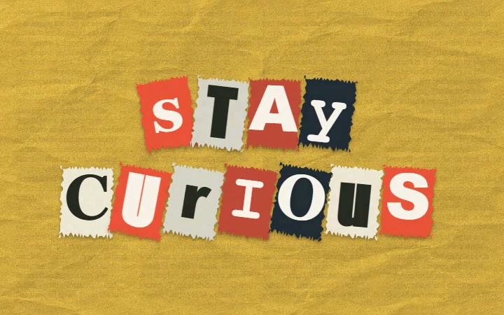 The words STAY CURIOUS assembled from magazine cutout letters