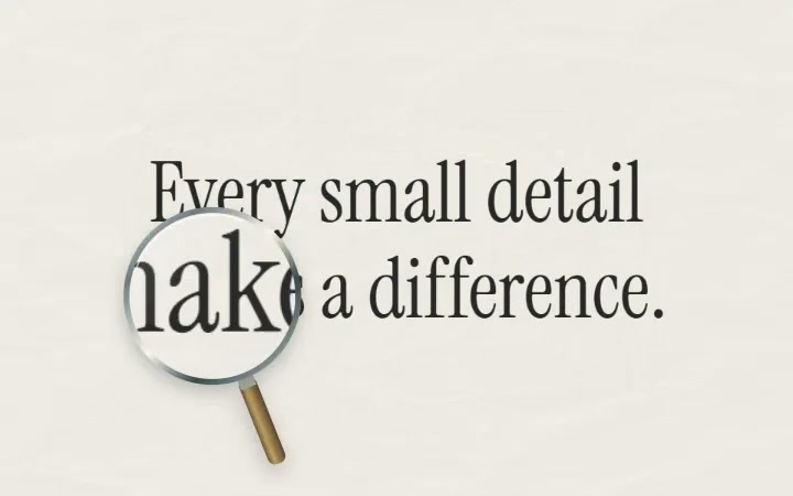A magnifying glass enlarges words on a paper quote