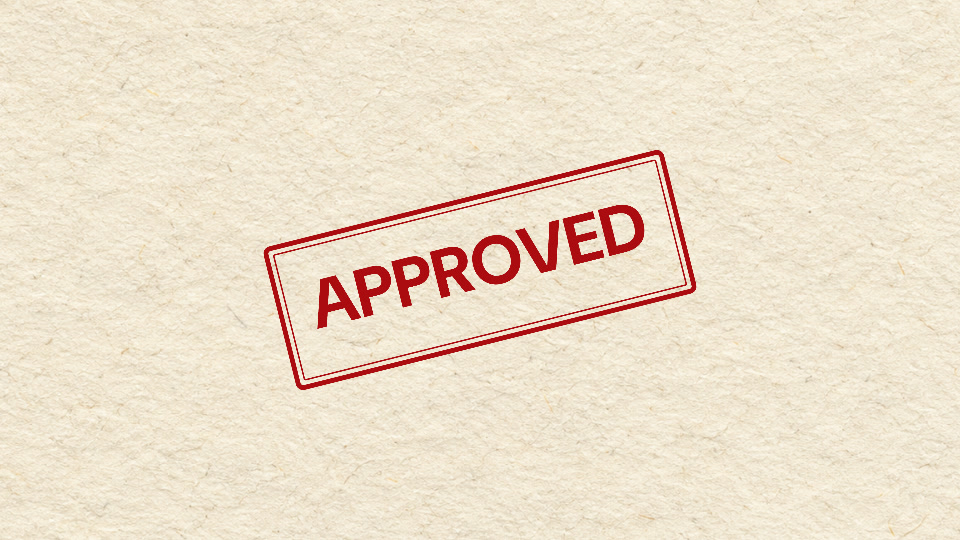 APPROVED stamped in red ink on ivory paper